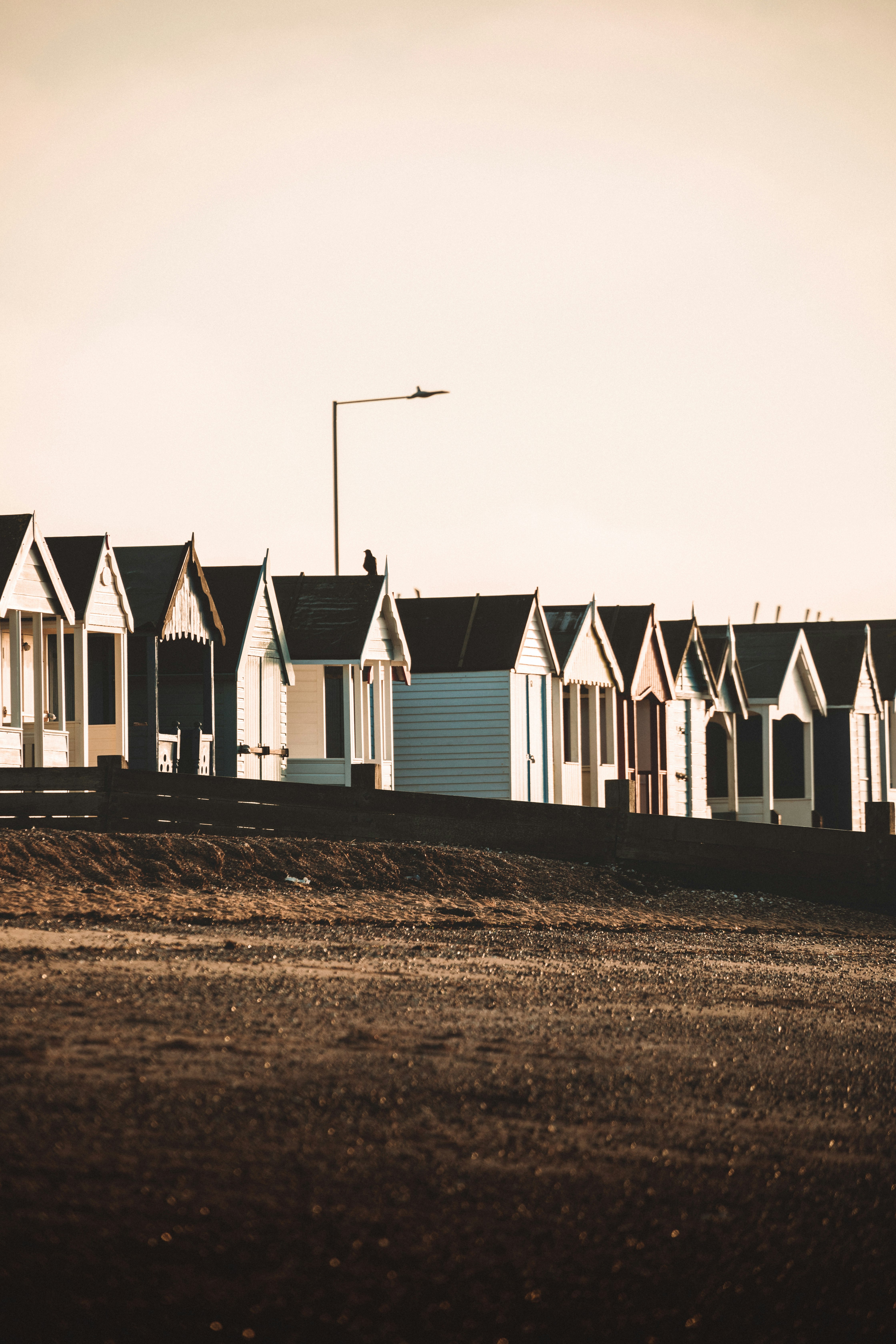 white and gray houses on brown field